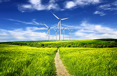 Green field with modern windmills 
